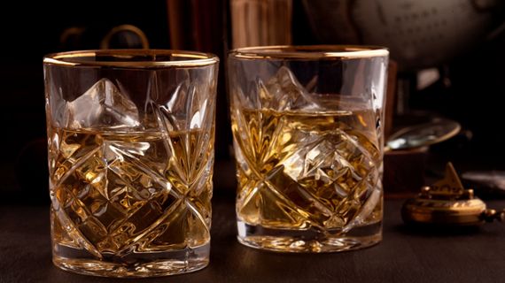 two glasses of brown liquer