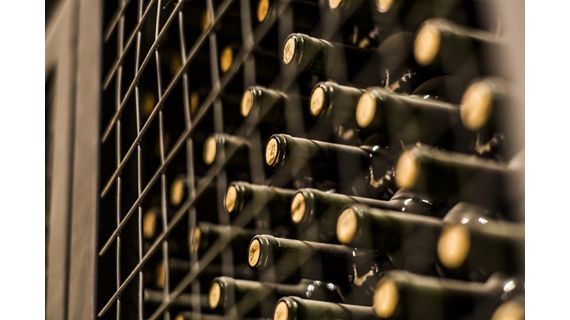 Close up shot of wine bottles in wine cellar, Mendoza, Argentina