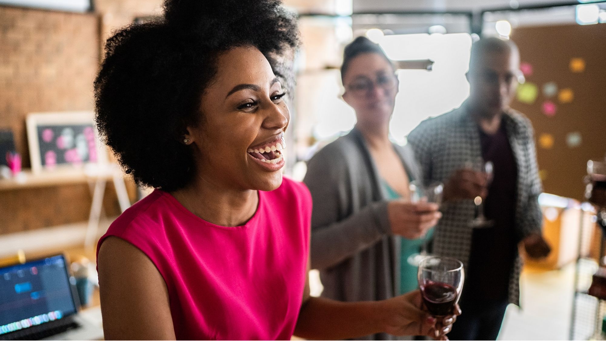 Woman toasting and smiling