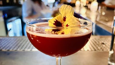 cocktail with flower garnish