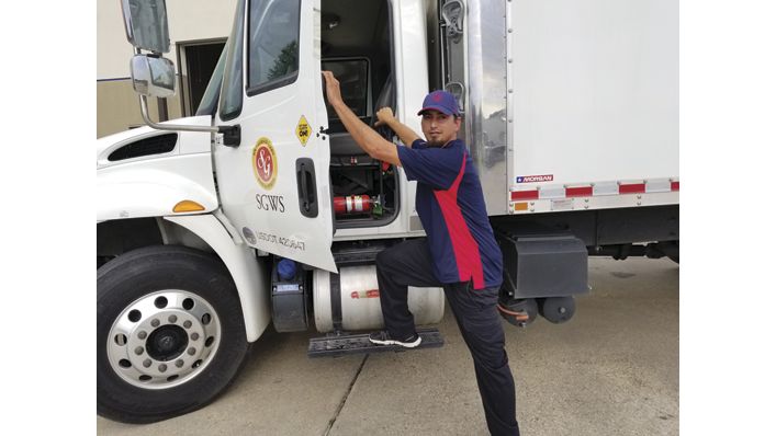 Driver getting into truck