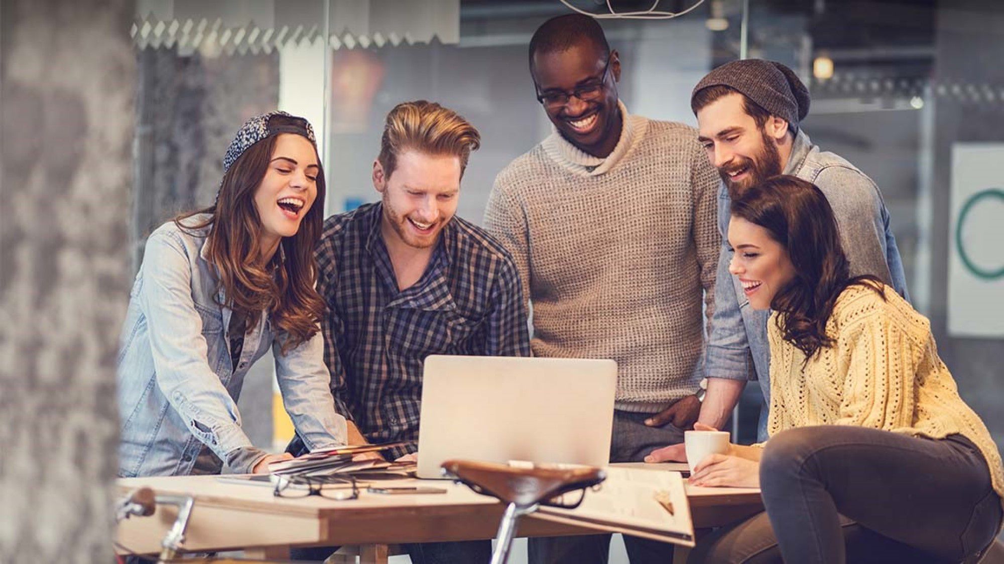 Diverse corporate team laughing together