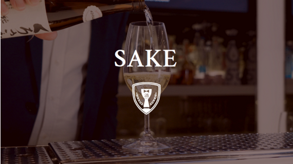 server pouring glass of sake