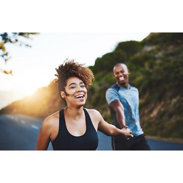 Stock photo of smiling couple in active gear