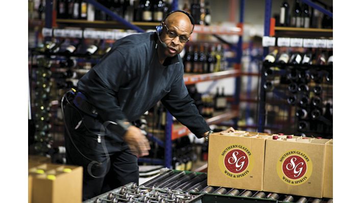 Distribution center employee with boxes