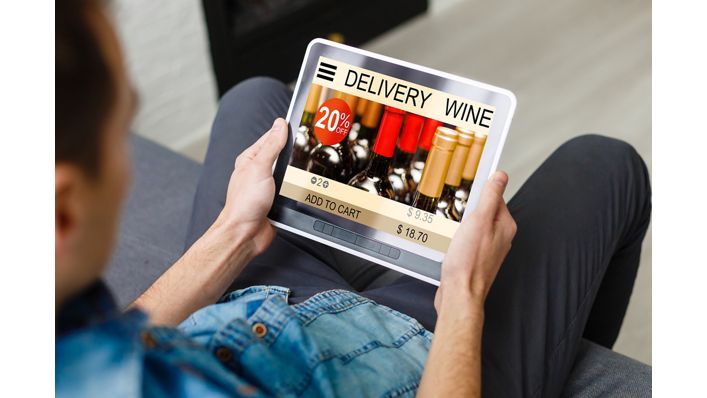 Hipster man hands holding digital tablet with app delivery food wine screen