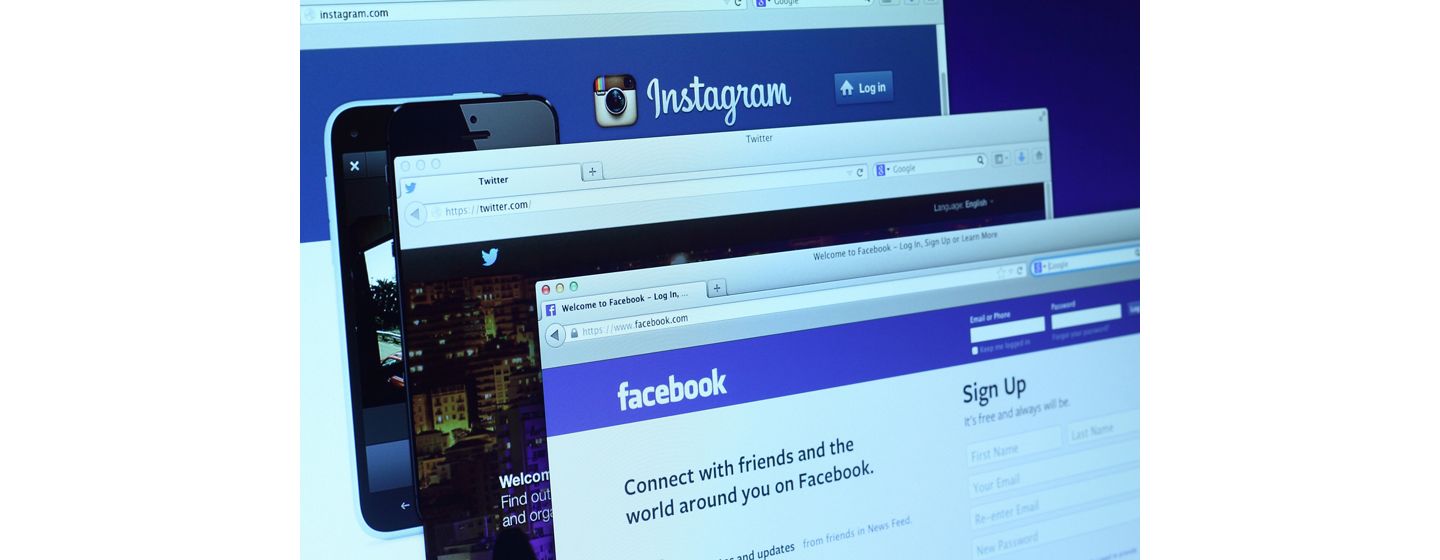 Close up of Instagram, Twitter and Facebook webpages open on a computer 