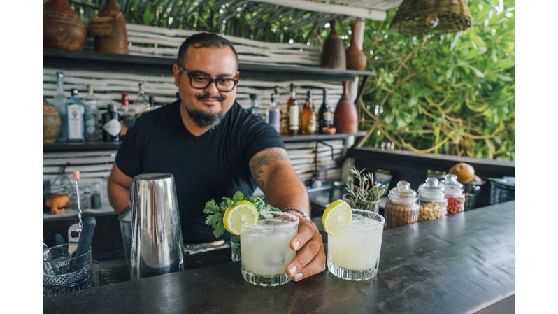 Male bartender mixing drinks