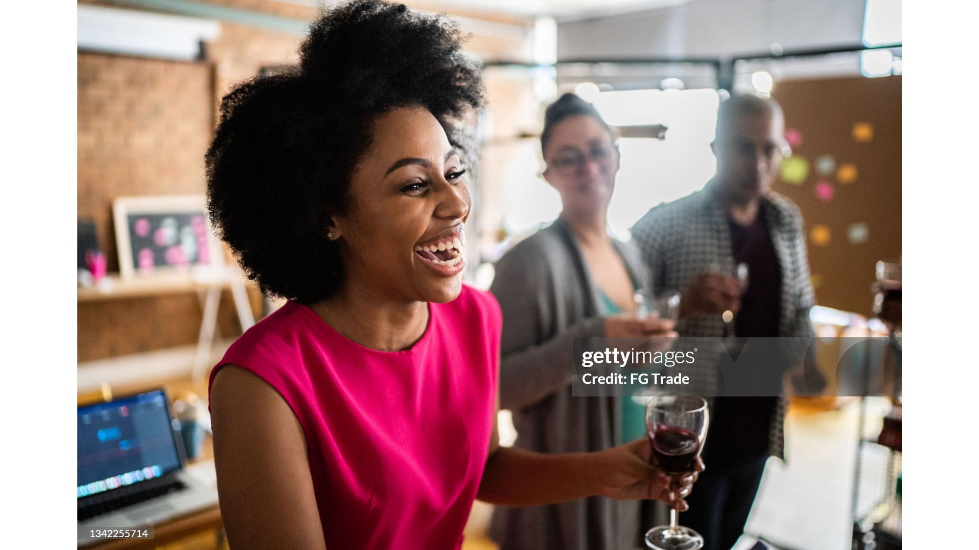 Woman toasting and smiling