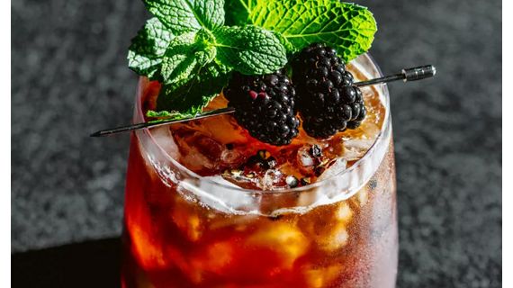 cocktail with rasberries on ice