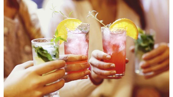 four people toasting no alcohol drinks