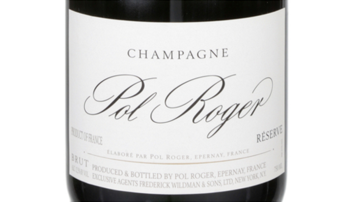 Close-up of a Pol Roger Champagne bottle, featuring its label detailing its origins and craftsmanship.
