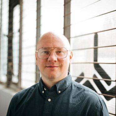 Headshot of Camper English.