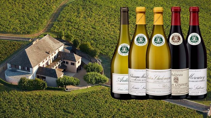An aerial view of the prestigious Louis Latour winery surrounded by lush vineyards, alongside a selection of their renowned white and red wines.
