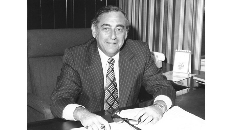 Harvey Chaplin sitting at his desk.